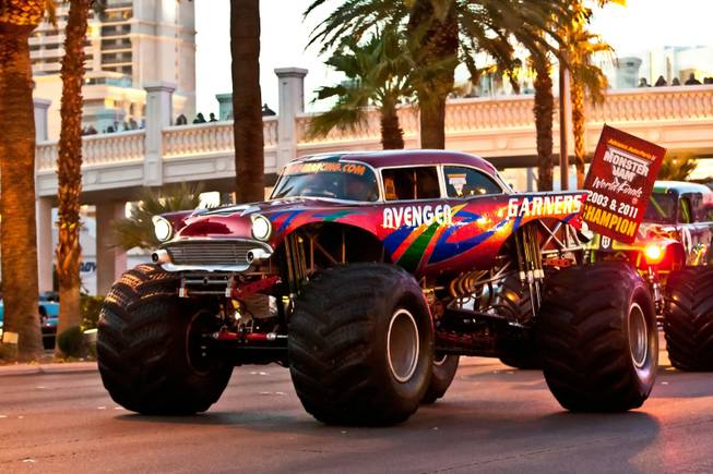 As fans gather along the sidewalks hooting and hollering, 11 Champions of Advance Auto Parts Monster Jam SM World Finals take possession of the Las Vegas Strip roaring their engines with force and precision parade style down Las Vegas Boulevard Thursday night, March 21, 2013.